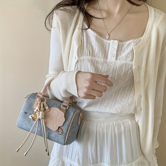 Fashionable women's denim blue diagonal backpack, paired with gold hardware and unique pendant - multifunctional single shoulder handbag